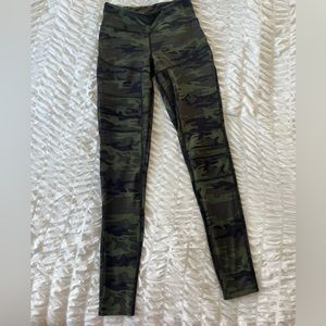 Army green workout leggings with cool cutouts and zipper pocket in back